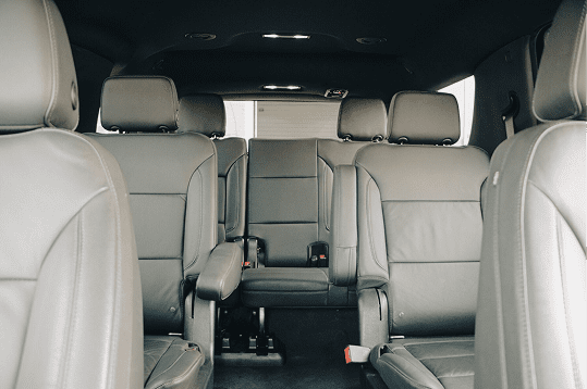 Interior of a spacious vehicle with seats.